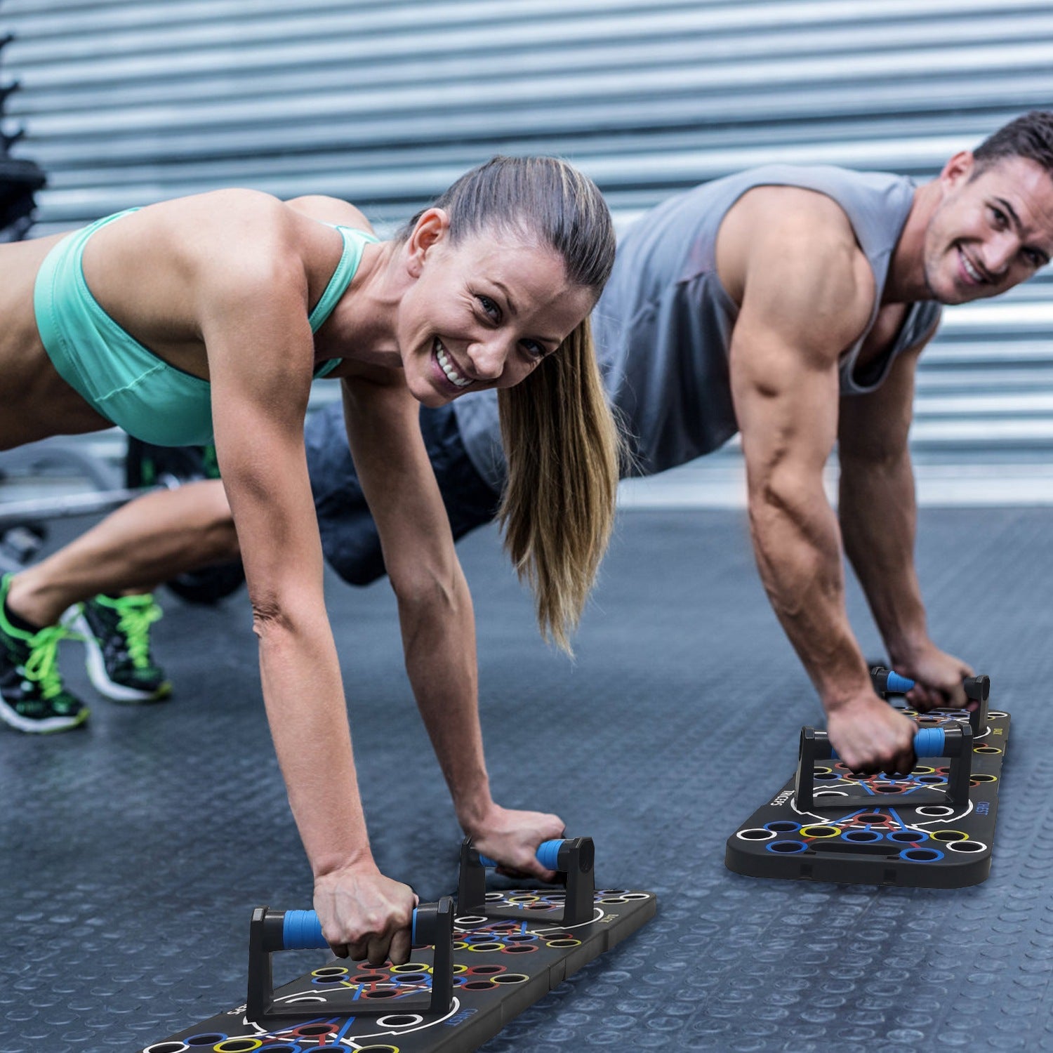 Two people doing push-ups on a fitness board outdoors.