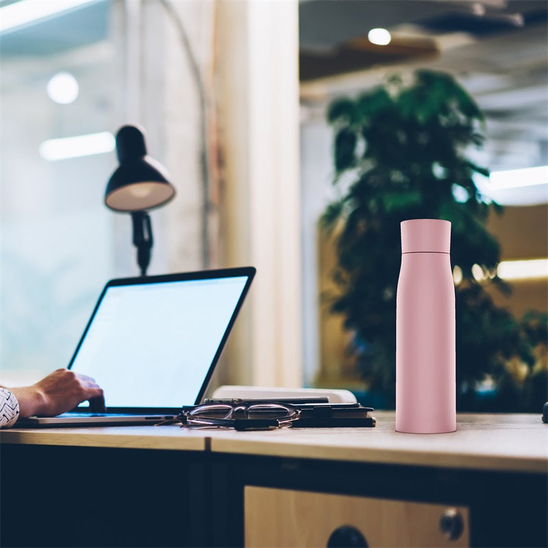 Working, with water bottle
